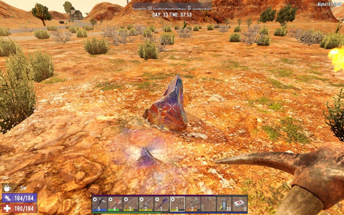 Screenshot from 7 Days to Die showing a shard of shale sticking out from the dessert floor.