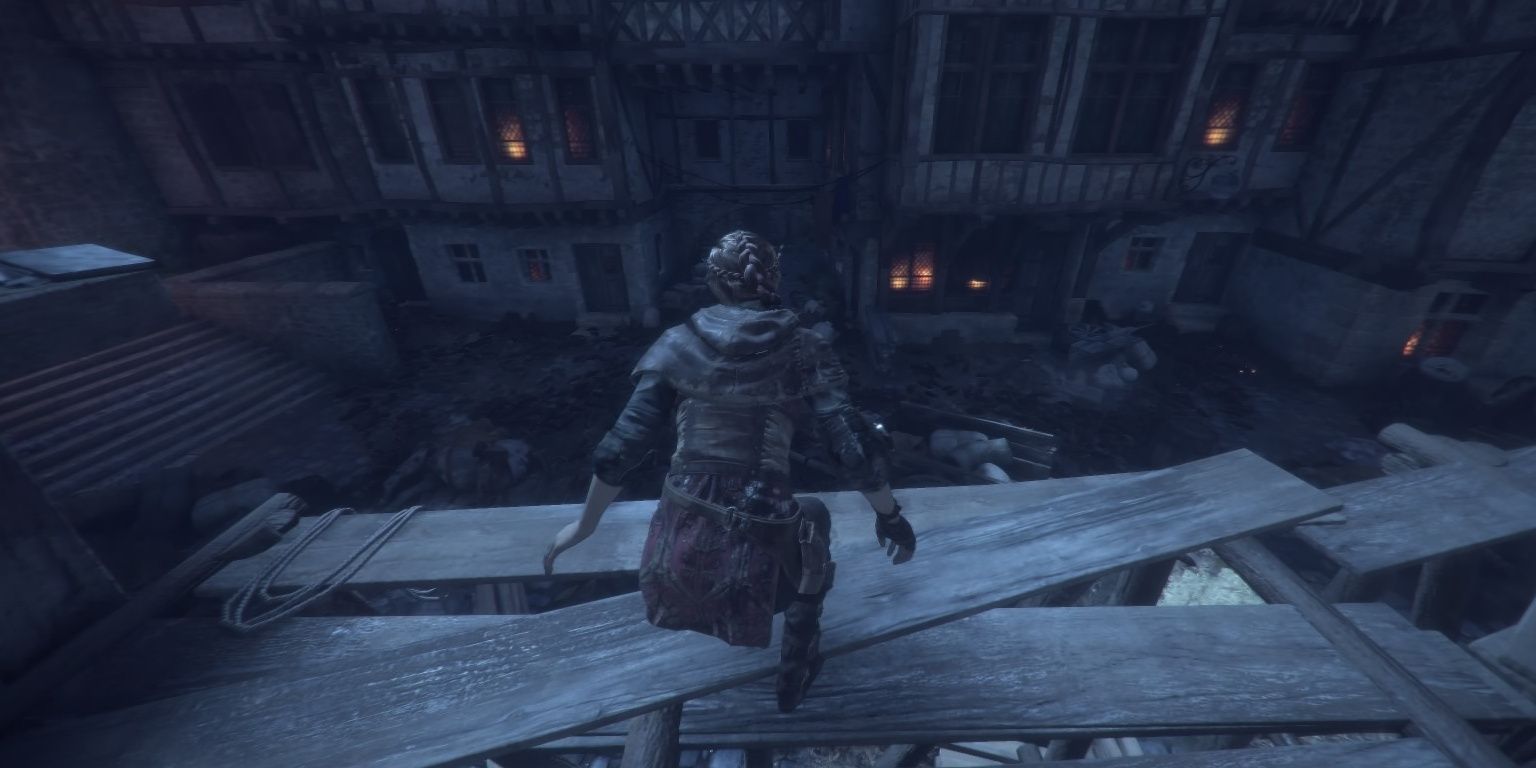 On the roof across a dark alley in A Plague Tale: Innocence.