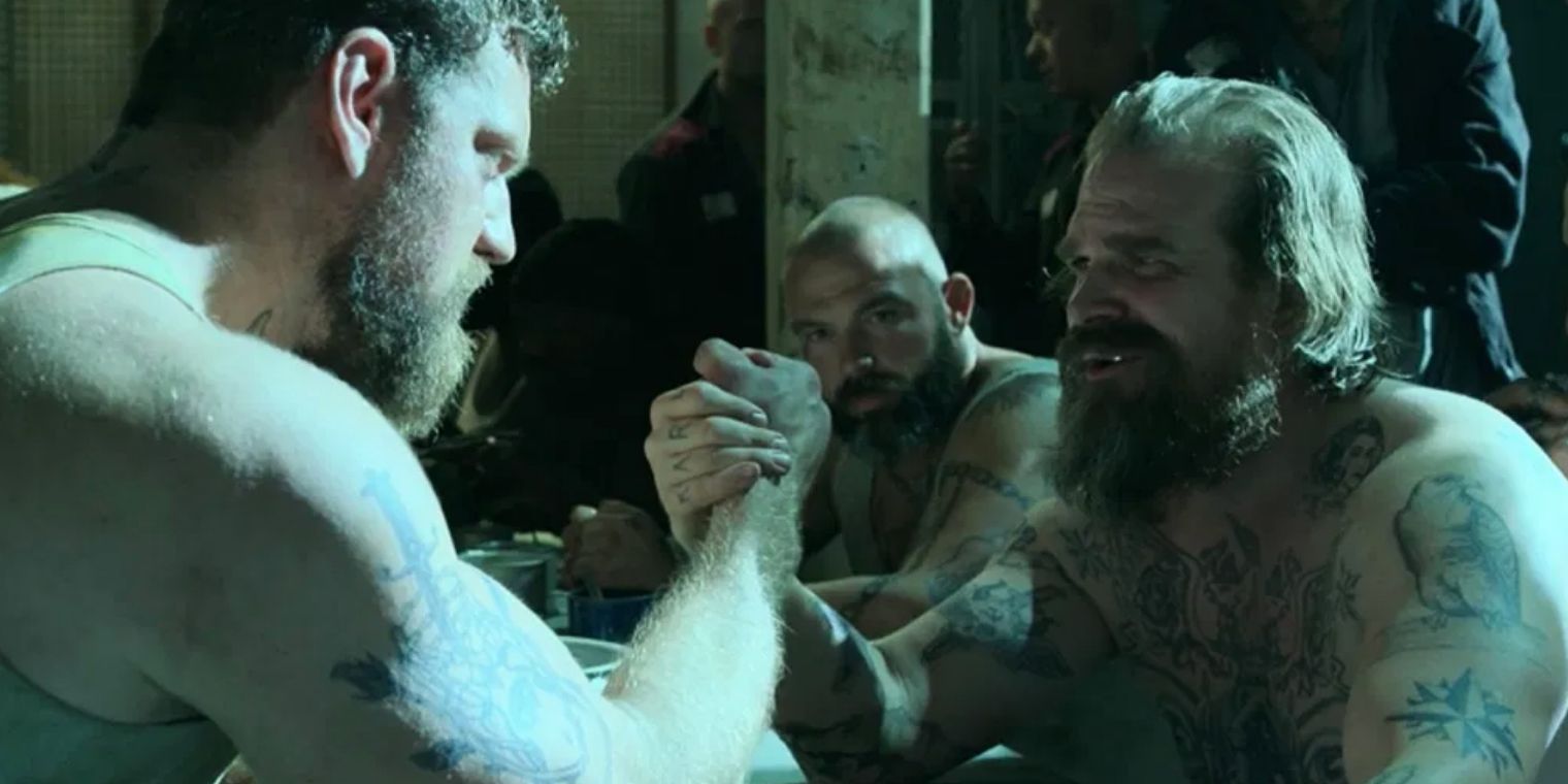 Alexei arm wrestles another inmate in prison in the Black Widow movie