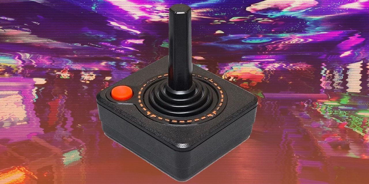 Atari Joystick controller against VHS picture of Mancunian arcade NQ64