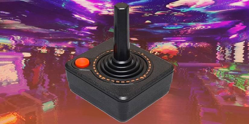 Atari Joystick controller against VHS picture of Mancunian arcade NQ64