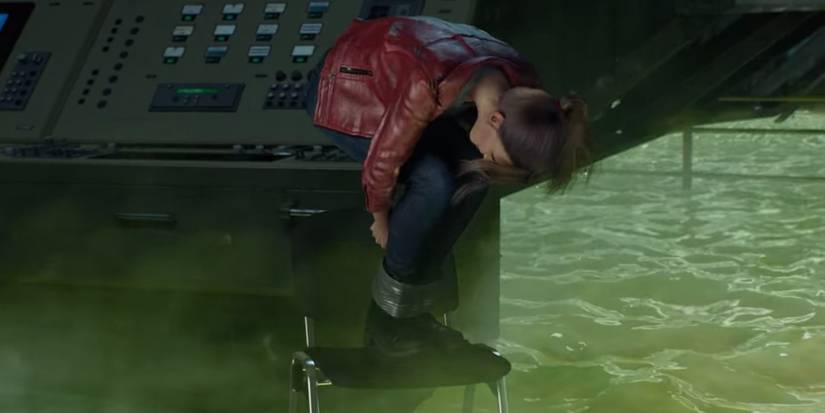 Claire untying herself on top of a chair