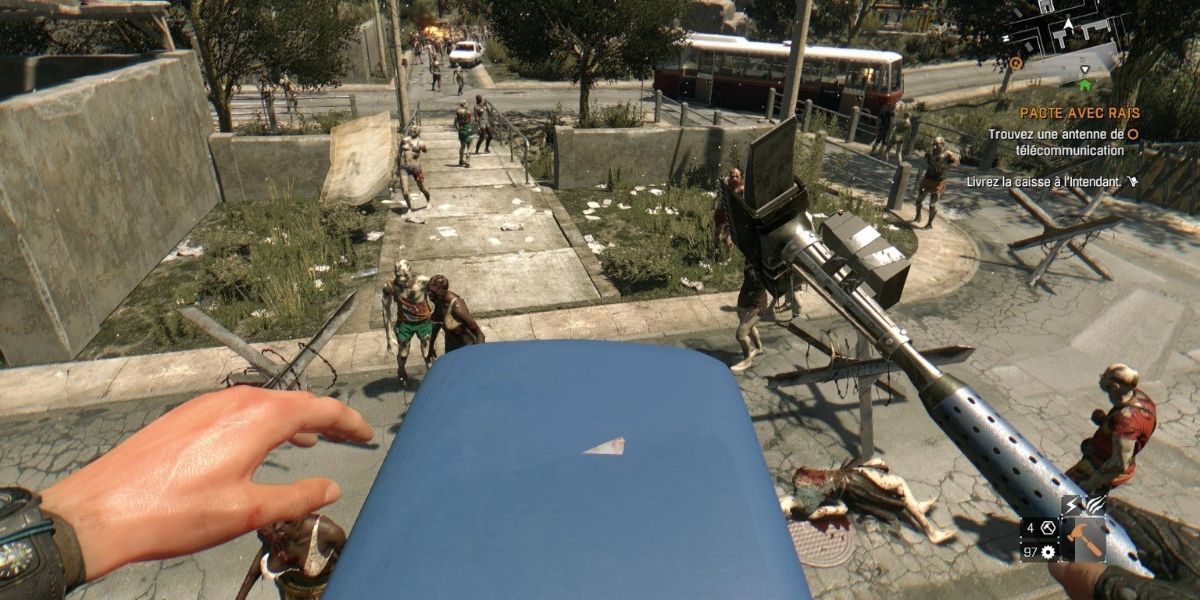 Dying Light Kyle standing on boss surrounded by zombies