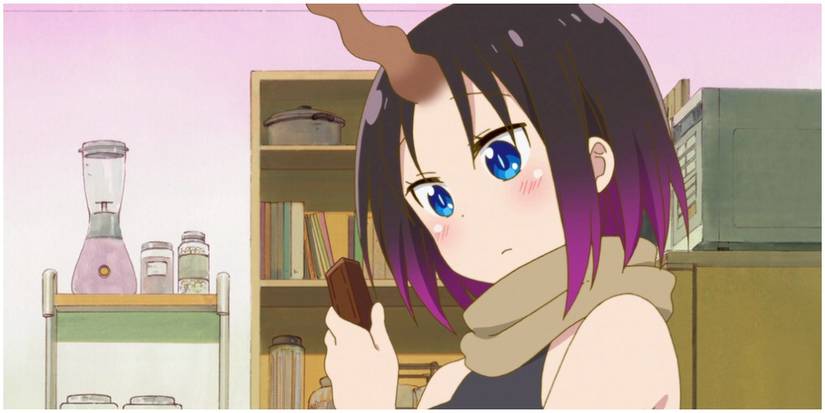 Elma trying to choose a chocolate.