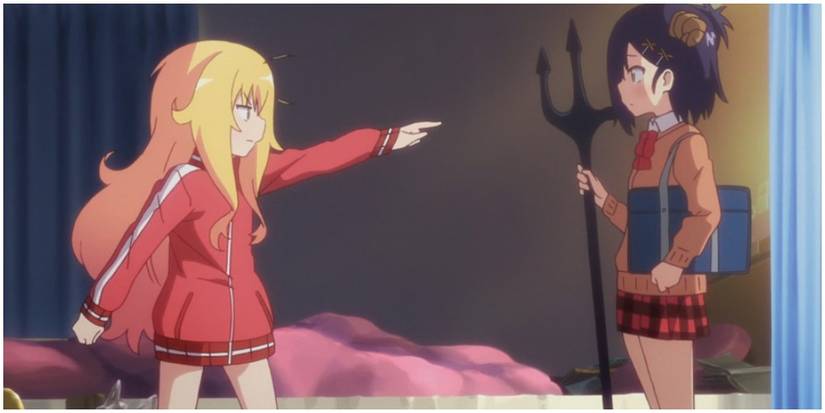 A disheveled girl pointing at another girl with a trident.