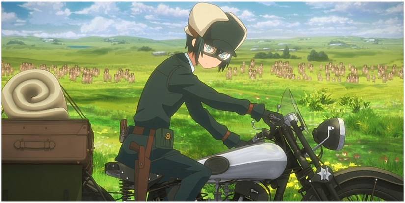 A young boy riding a motorbike.