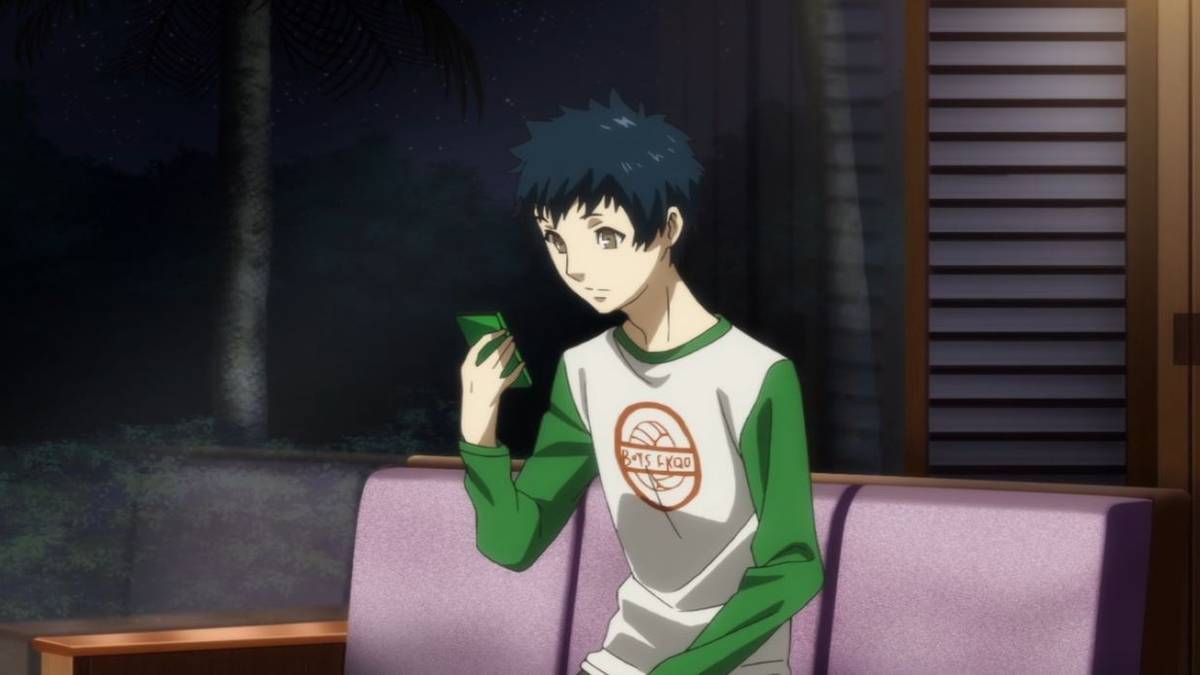 yuuki mishima looking at his phone in persona 5
