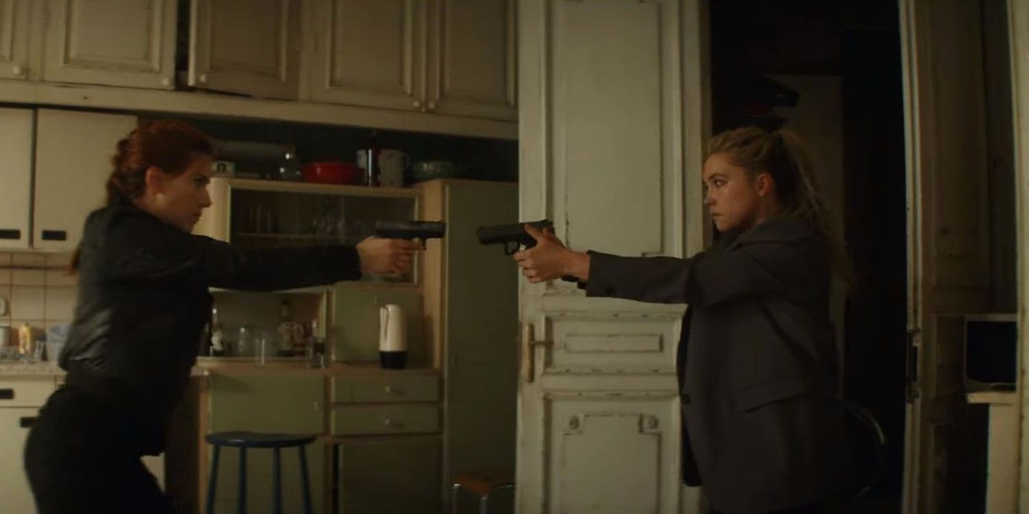 Natasha and Yelena hold guns on one another in the Budapest safe house in Black Widow