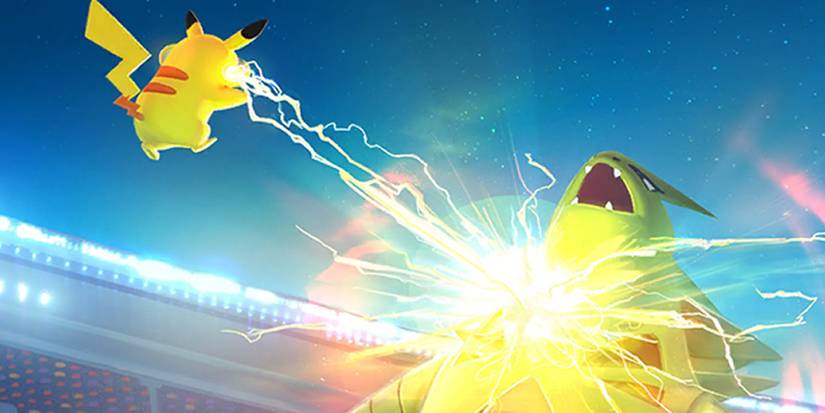 Pikachu fighting a Tyranitar