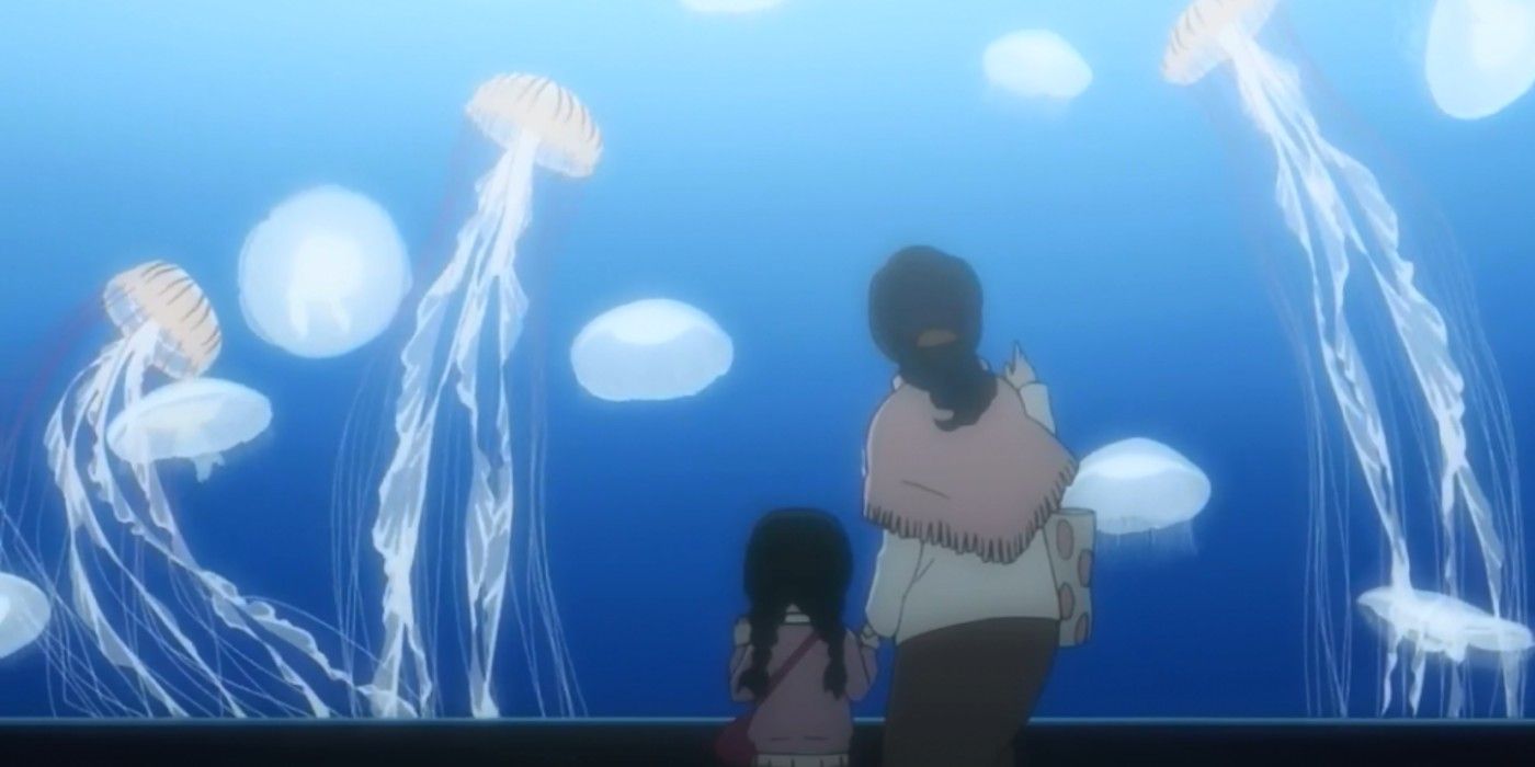 Princess Jellyfish Mom And Young Daughter Standing Next To Each Other At Aquarium