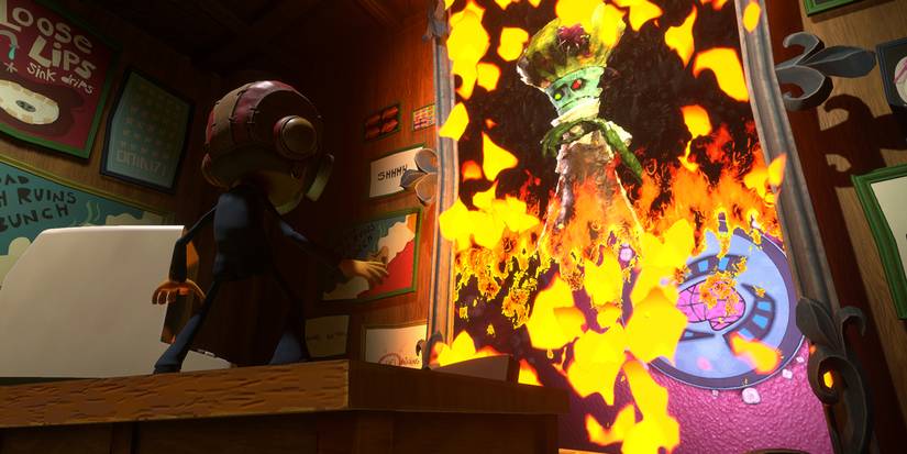 Raz lights a photo frame on fire with loboto inside