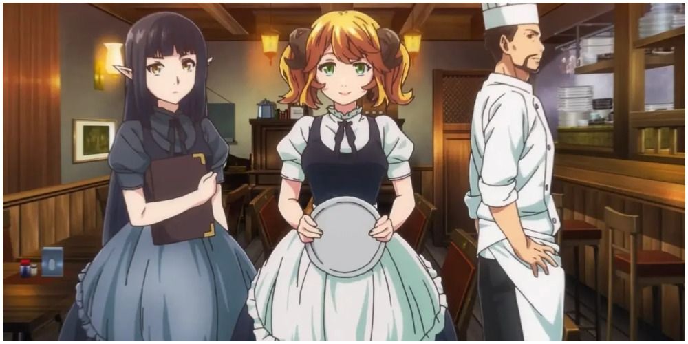 Two waitresses and a chef standing together in a restaurant.