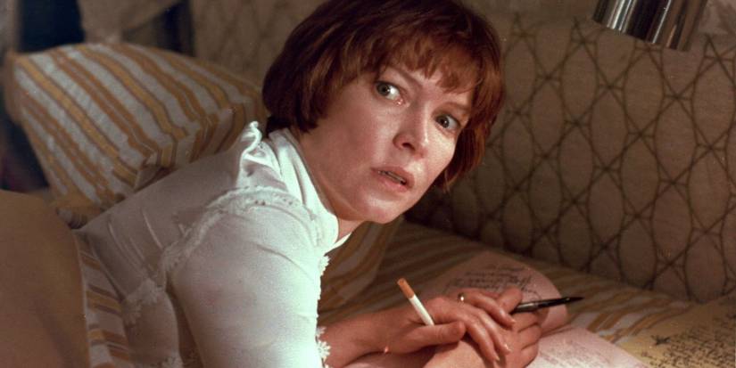 Chris Macneil (Ellen Burstyn) writing in bed in a scene from The Exorcist