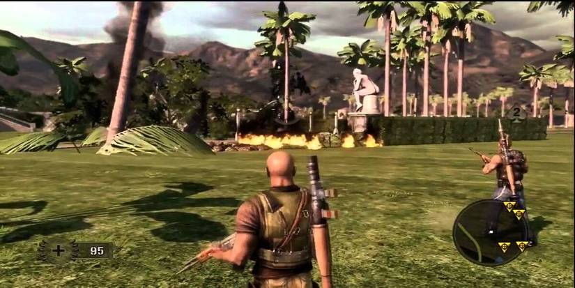 Two men approaching a fire