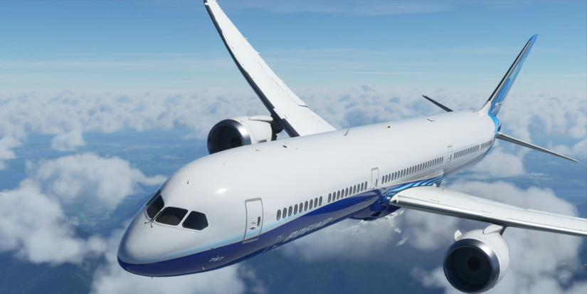the large white and blue airliner aircraft flying through the sky.