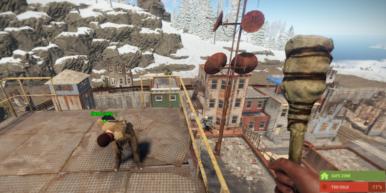 2 players on top of an outpost building.
