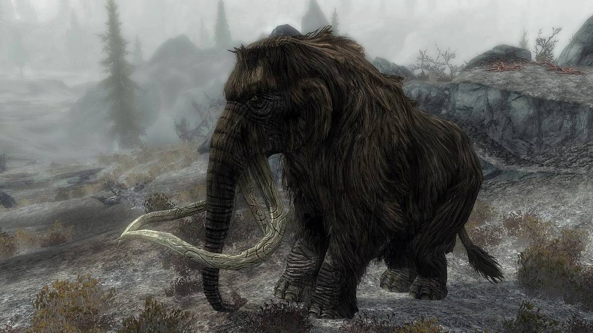Screenshot from Skyrim showing a mammoth roaming the land.