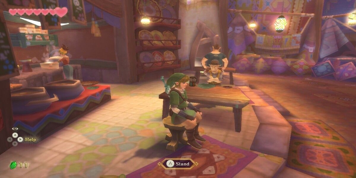 Link sitting at a table