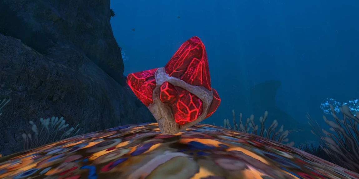 red gem floating in the water.
