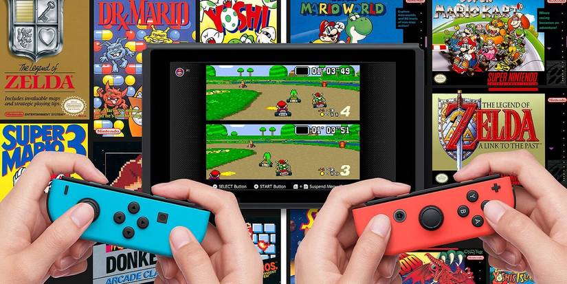 Two people using a Nintendo Switch to play Mario Kart with other SNES and NES games in the background.