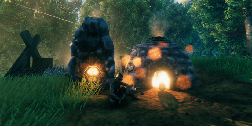 player sitting by a forge.