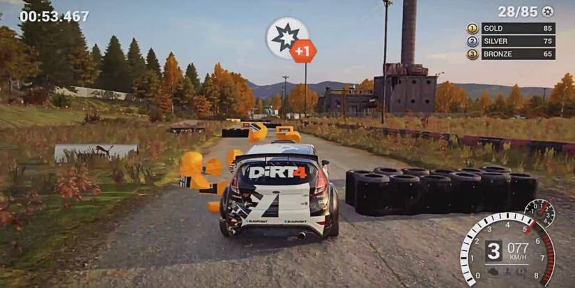 Dirt 4 gameplay rally car plowing through obstacles and tires on dirt road