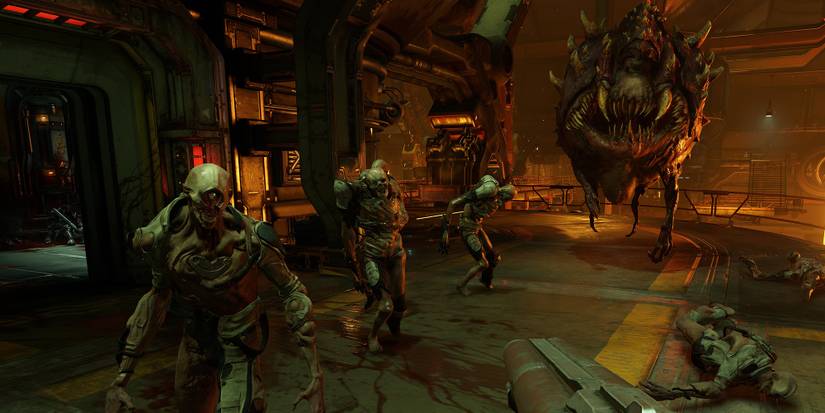 Doom, wielding a shotgun against several demons in a foundry