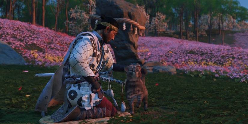 Ghost Of Tsushima Jin pets a cat at a sanctuary