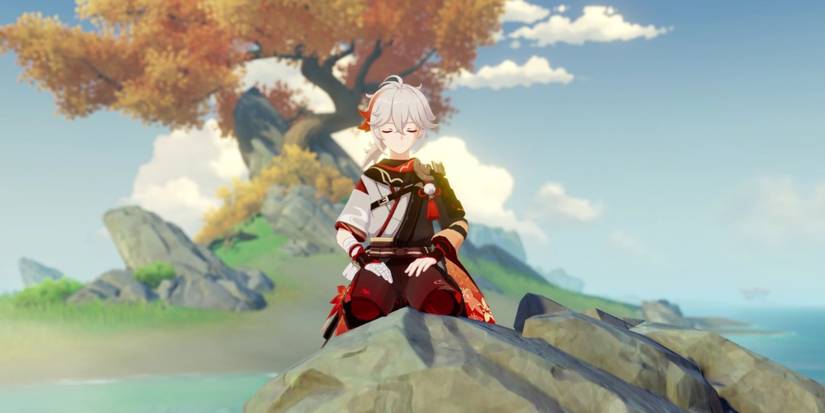 Kazuha sitting calmly on a rock