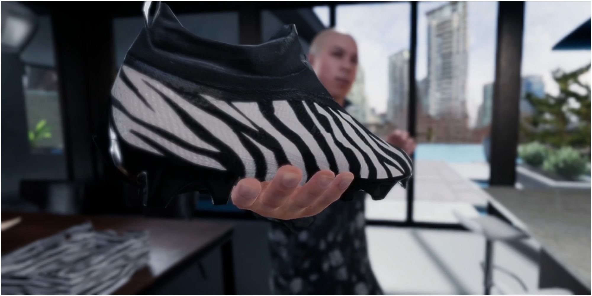 Madden NFL 22 Holding Up The Zebra Shoe To The Camera
