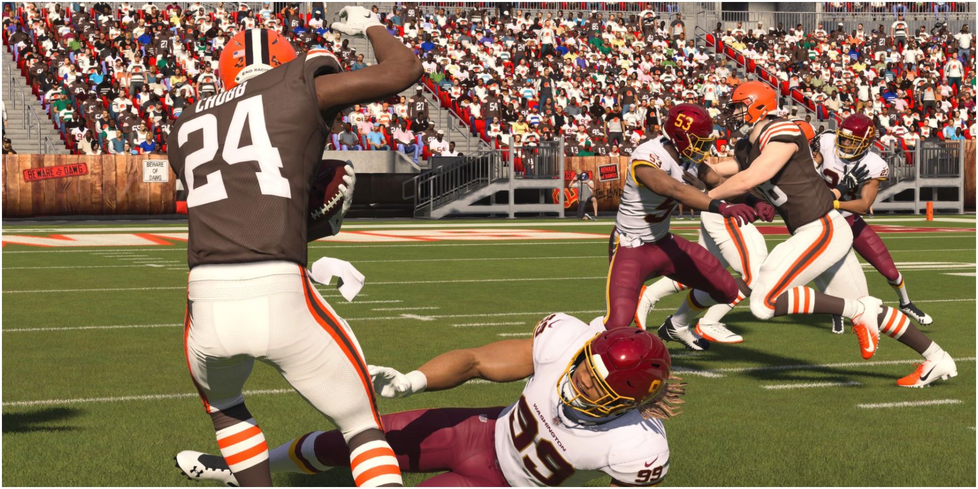 Madden NFL 22 Nick Chubb Leaping Over A Downed Washington Defender
