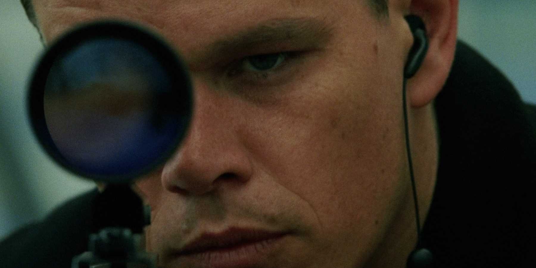 Jason Bourne looking through rifle in The Bourne Supremacy