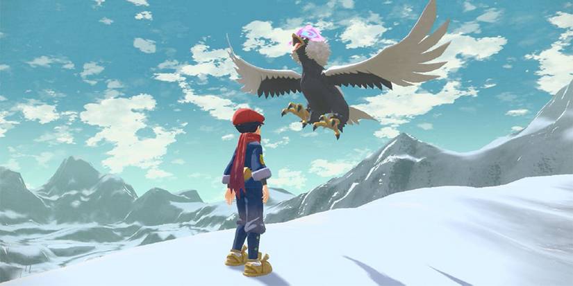 Pokemon-Legends-Arceus-a-character-looks-at-Hisuian-Braviary-1