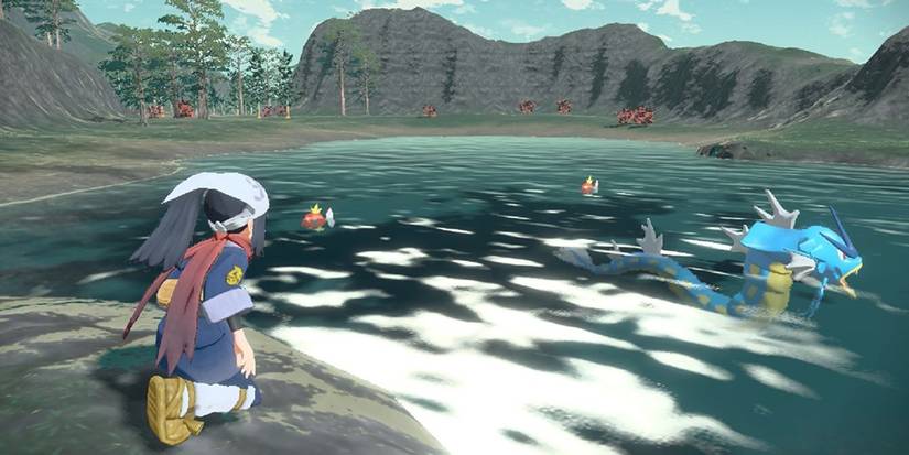 Pokemon Legends Arceus a character scouts water Pokemon