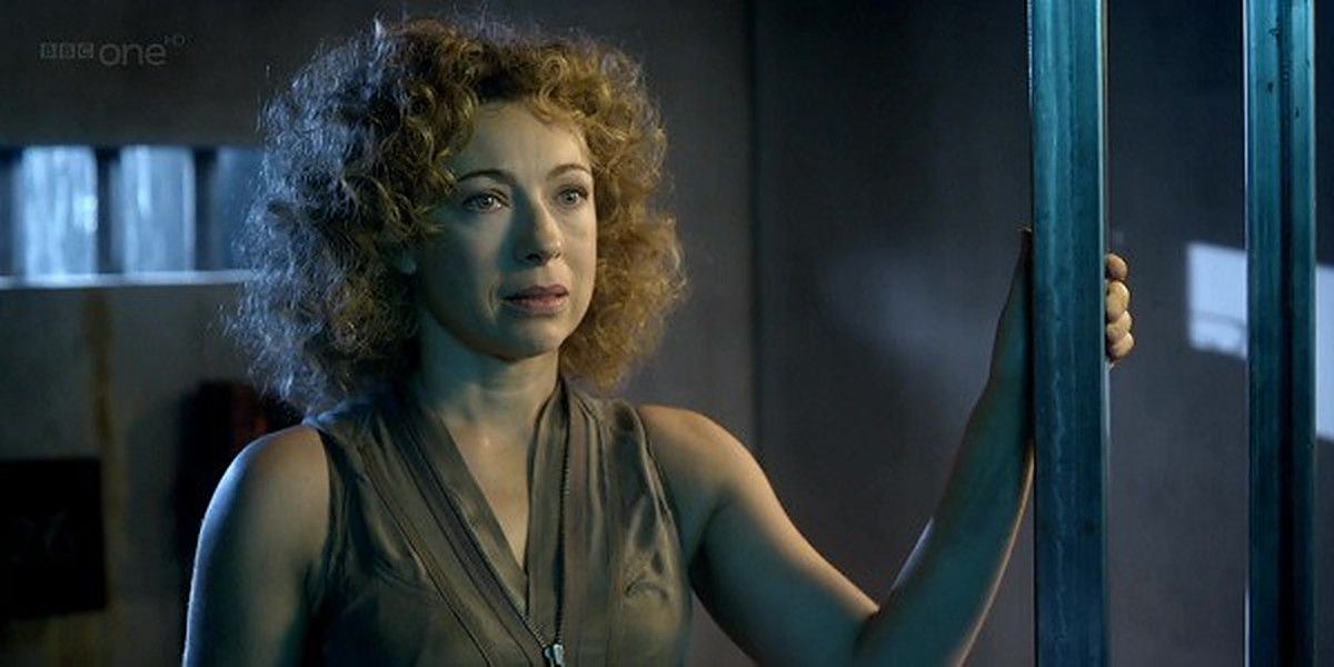 River Song stands in her prison cell in Doctor Who
