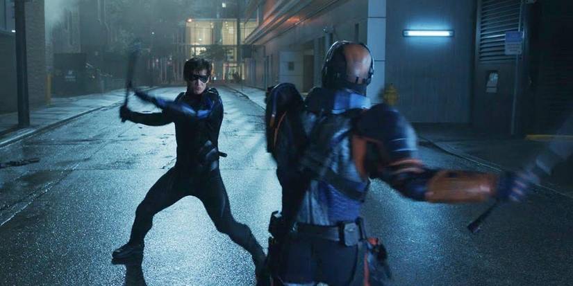 Robin fighting Deathstroke