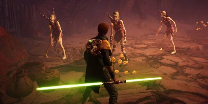 Cal holding a double-ended lightsaber