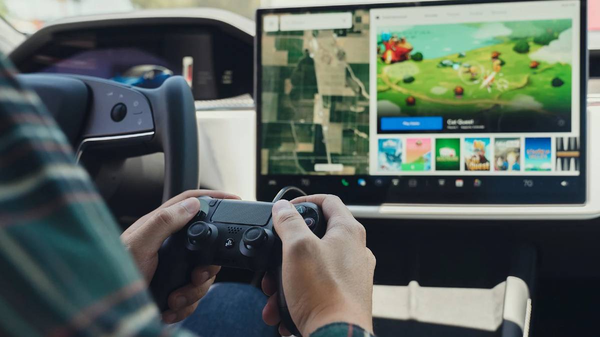 Person playing video game in Tesla