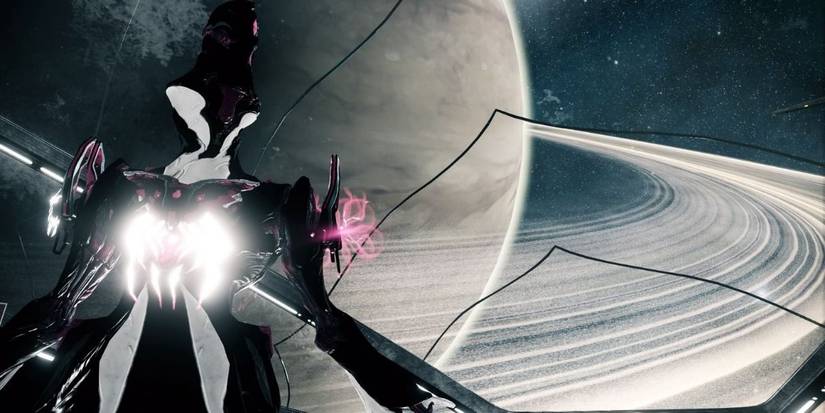 Warframe Limbo standing on playing ship with Saturn in the background