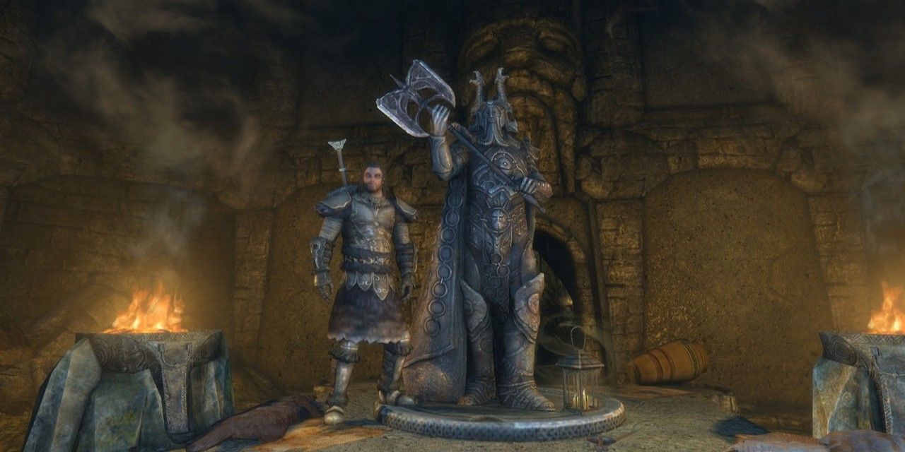 a warrior standing next to the statue of Ysgramor in Skyrim