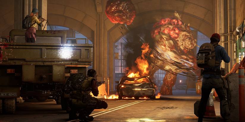 A screenshot from Back 4 Blood showing the Cleaners fighting an Ogre in a tunnel.