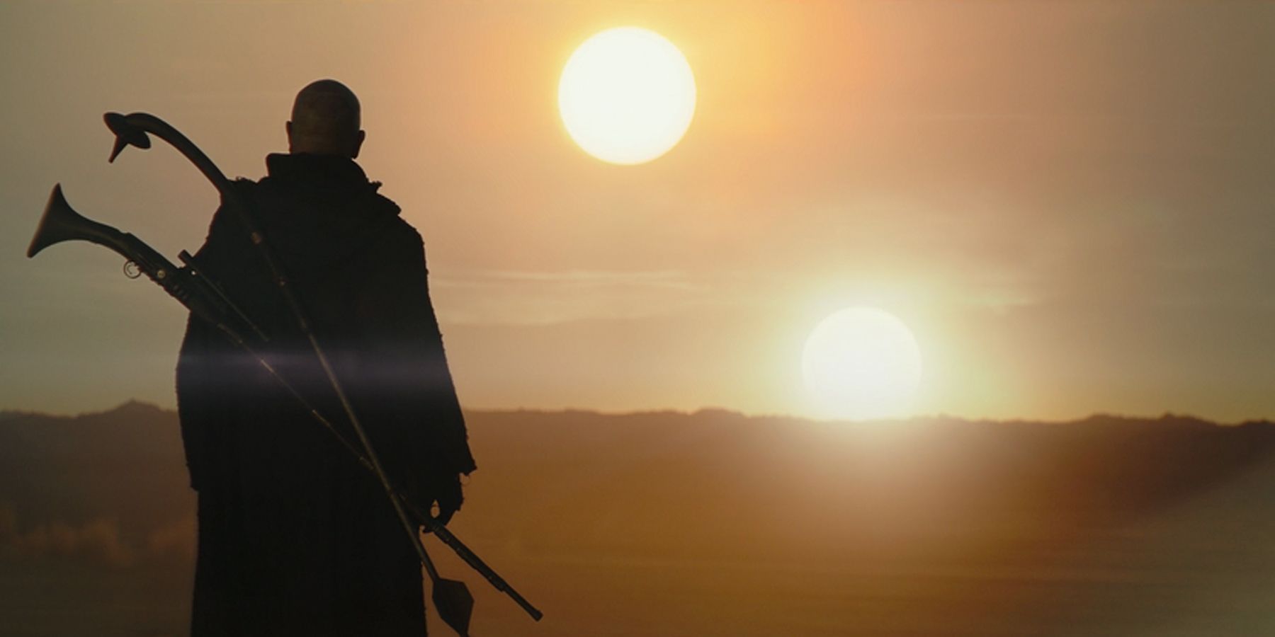 Boba Fett the Mandalorian Bounty Hunter, and clone of deceased Mandalorian Bounty Hunter Jango Fett, stands and watches the sunset on Tatooine.