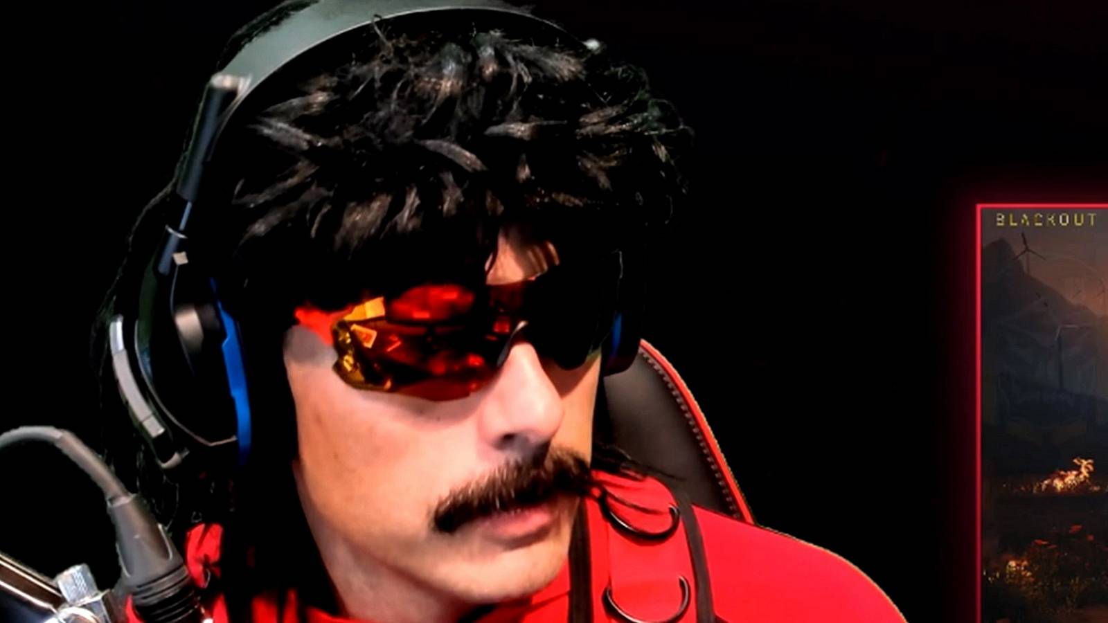 Close up of YouTube streamer Dr Disrespect in his trademark sunglasses and wig,