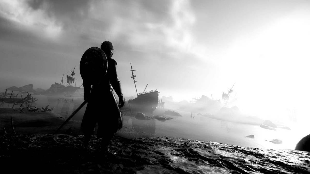 black and white image of soldier looking out at sea