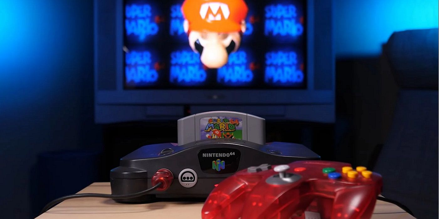 A photo of a Nintendo 64 console with Super Mario on a TV in the background.