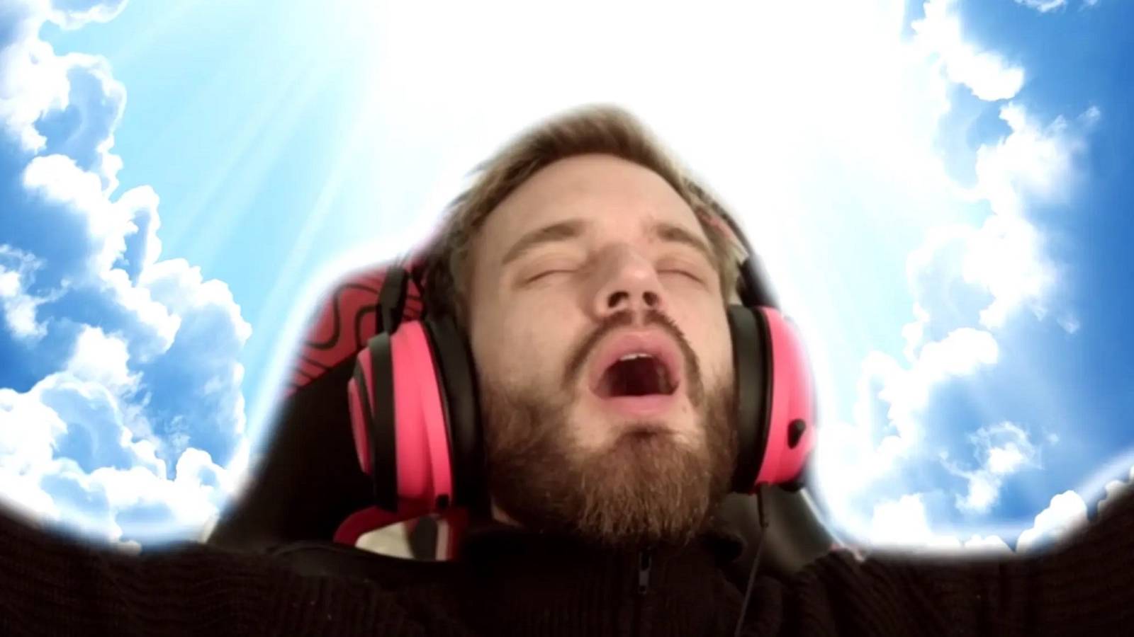 A photo of PewDiePie on a sky background looking up towads the heavens.