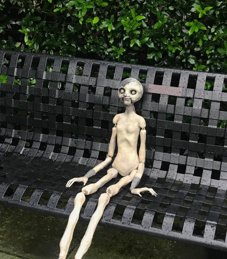 resident-evil-village-vertical-angie-doll-sitting-1