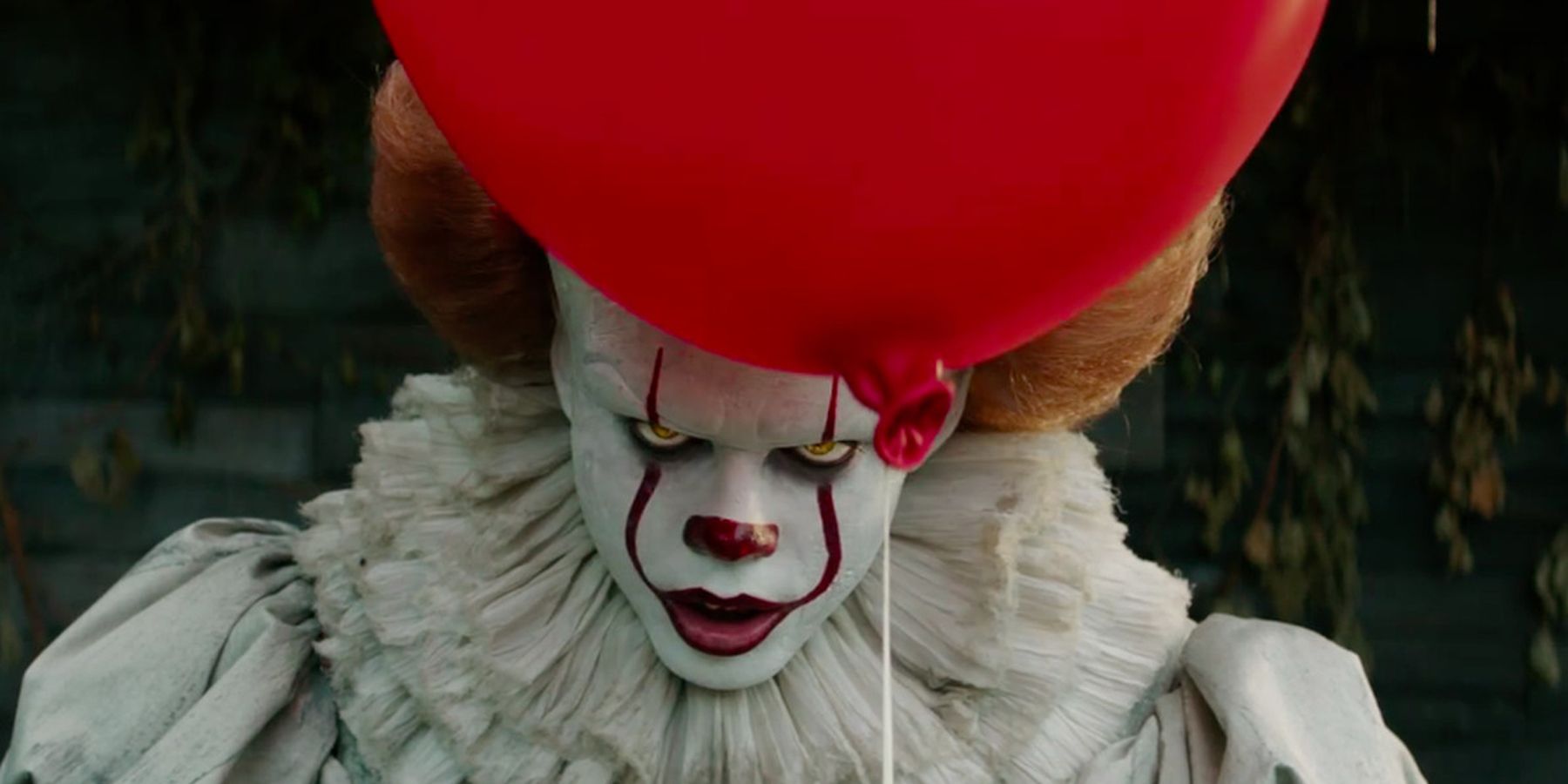 A look at Pennywise behind a balloon from IT 2017