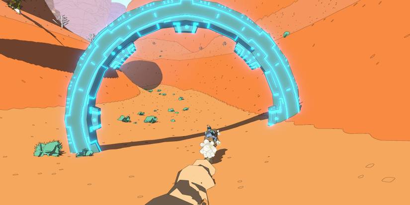 Sable riding her jetbike through a large, glowing, blue ring in the sand
