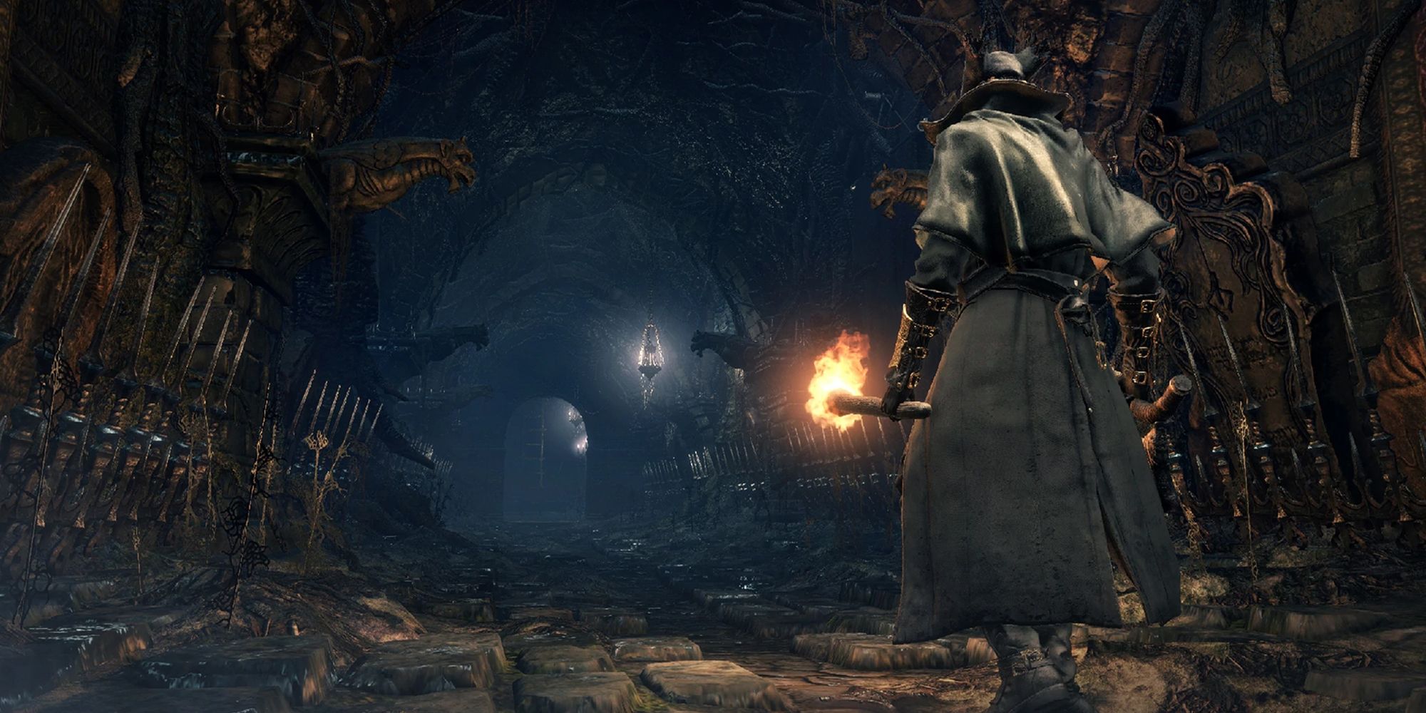 Bloodborne - A Hunter Walking Down A Long Hallway In A Chalice Dungeon